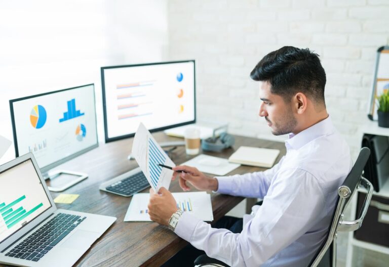 Thumbnail-For-Accountant-Examining-Sales-Data-By-Deducto