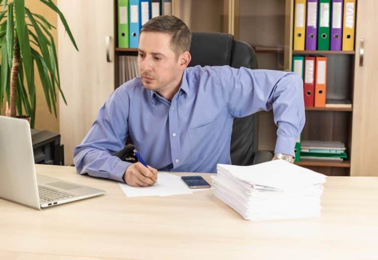 Thumbnail-for-Businessman-Desk-Office-Looks-Into-Laptop-Screen-By-Deducto